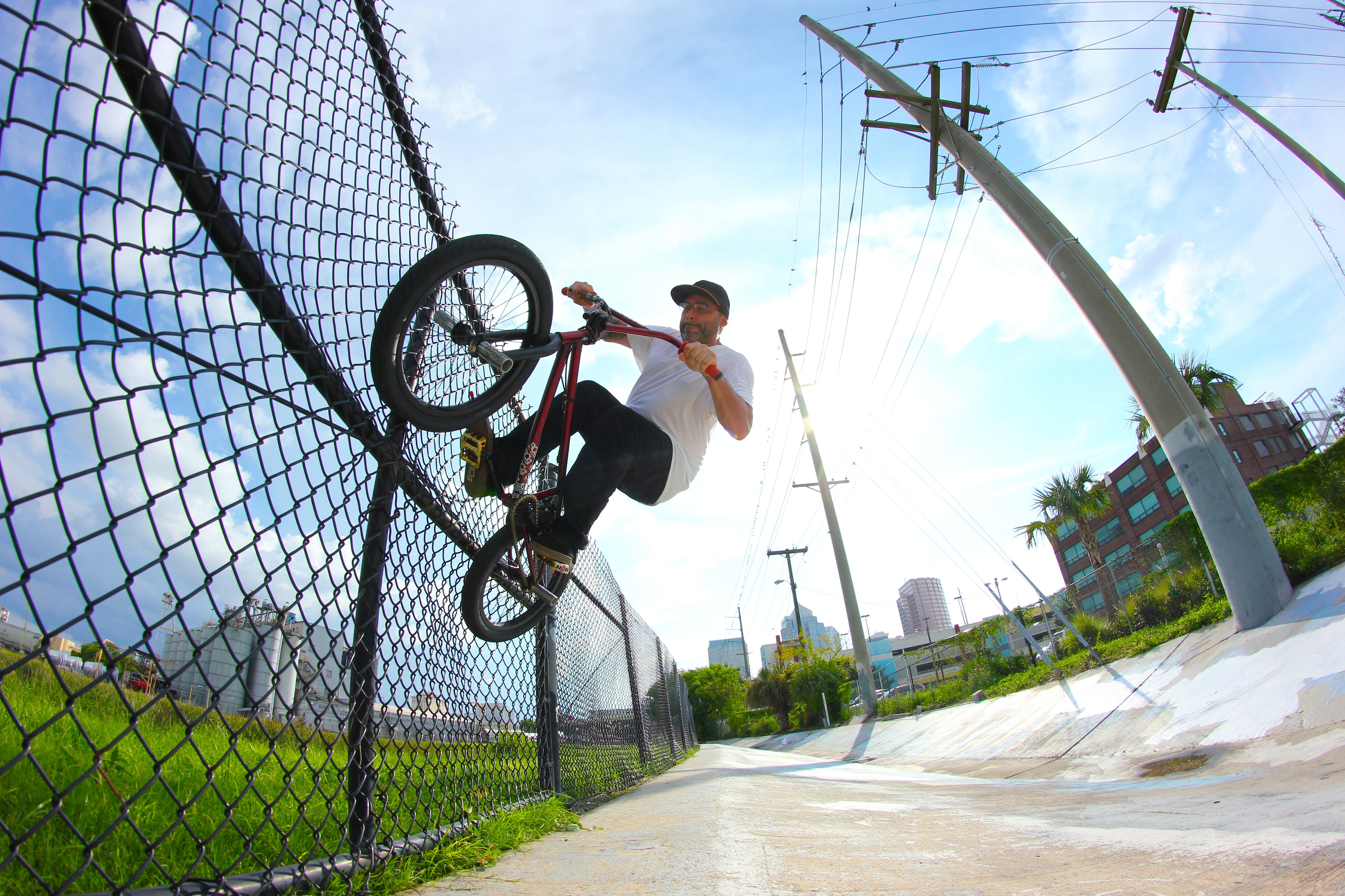 Did you know a bmx shoe company is run out of Florida? Actually, the first rider owned shoe company. SCG Shoes owner, Steve Caro, with an ice on the not so sturdy fence while fertilizer wafts into the humid Tampa Air. 